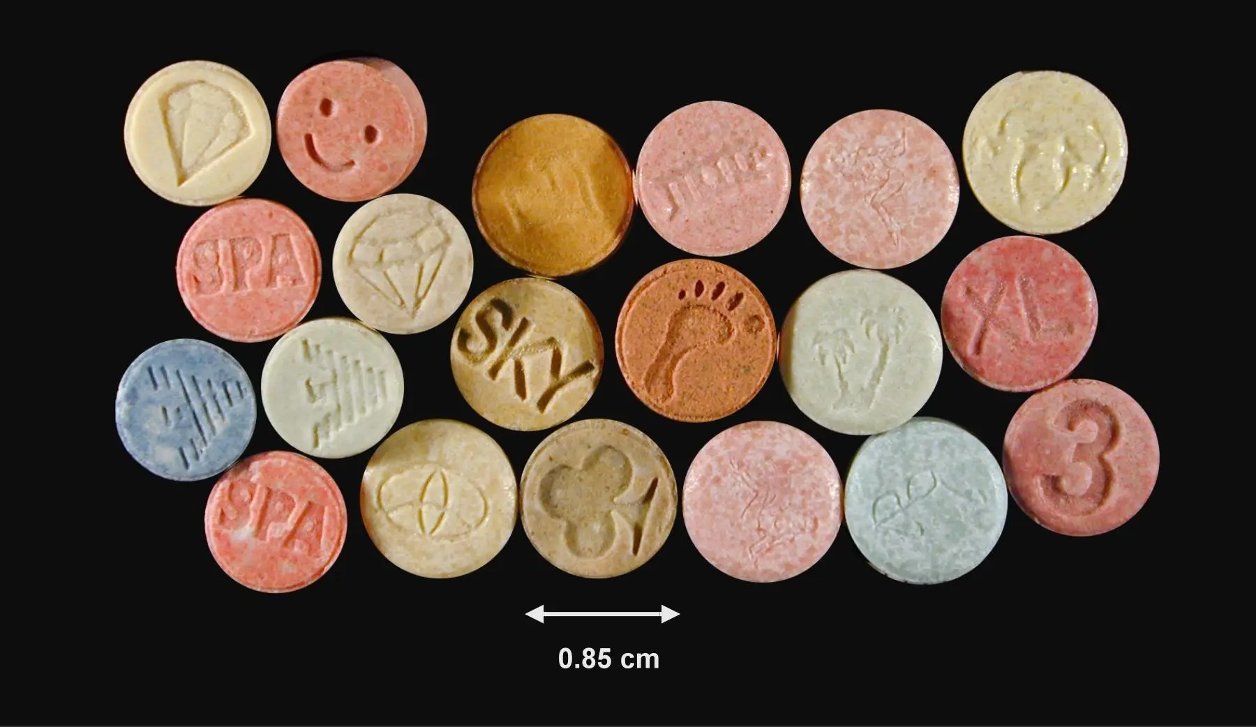 Assorted Ecstasy tablets in different colors and designs